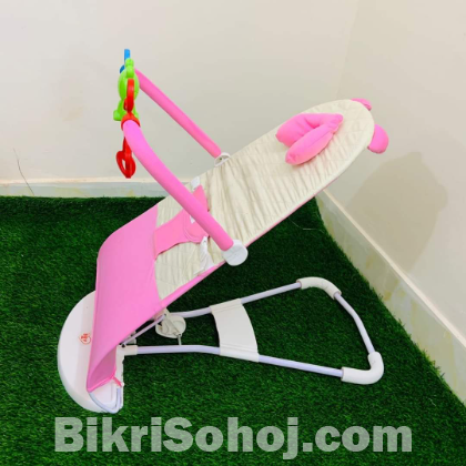 Automatic musical bouncer chair